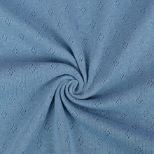 Load image into Gallery viewer, Vintage blue pointelle knit jersey fabric from Once Upon A Fabric with diamond-shaped perforations. The pointelle cotton jersey fabric appears lightweight, suggesting it may be perfect for baby clothes or accessories.
