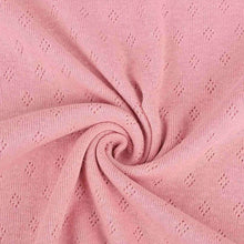 Load image into Gallery viewer, French rose pink pointelle knit jersey fabric from Once Upon A Fabric with diamond-shaped perforations. The pointelle cotton jersey fabric appears lightweight, suggesting it may be perfect for baby clothes or accessories.
