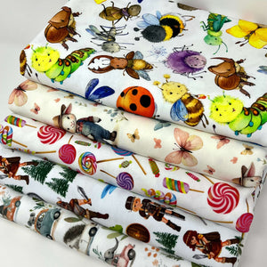 Organic stretch jersey fabric with colourful happy bugs, perfect for baby clothes, showcases various whimsical cartoon insects, including a bumblebee, ladybug, dragonfly, beetle, grasshopper, and spider.