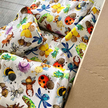 Load image into Gallery viewer, Organic stretch jersey fabric with colourful happy bugs, perfect for baby clothes, showcases various whimsical cartoon insects, including a bumblebee, ladybug, dragonfly, beetle, grasshopper, and spider.
