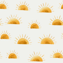 Load image into Gallery viewer, The image shows a repeating pattern of hand-drawn yellow suns with rays against a light-colored background, perfect for baby clothes. The suns are depicted at various stages of rising, with some partially visible above the horizon line. This design is printed on soft cotton Jersey Fabric - SUNSET by Family Fabrics from Once Upon A Fabric and is Oeko-Tex 100 certified.
