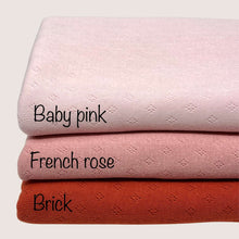 Load image into Gallery viewer, Three knitted fabric swatches, made from lightweight cotton fabric, are stacked on top of each other. They are labeled in black text as follows: the top swatch is &quot;Baby pink,&quot; the middle swatch is &quot;Pointelle Jersey - French Rose&quot; by Once Upon A Fabric, and the bottom swatch is &quot;Brick.&quot; These samples proudly boast Oeko-Tex 100 certification.
