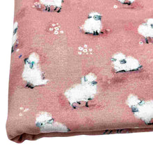 Load image into Gallery viewer, Baby fabric features a delightful pattern of small white sheep on a pink background, interspersed with tiny white flowers.
