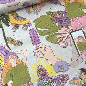 A colorful fabric pattern perfect for home furnishing, featuring illustrations of a woman with long hair, butterflies, a hand holding a popsicle, roller skates, and a smartphone displaying the woman. The 97 cm REMNANT 100% Premium Cotton - Retro Summer from Once Upon A Fabric showcases shades of green, yellow, pink, purple, and orange on 100% cotton.